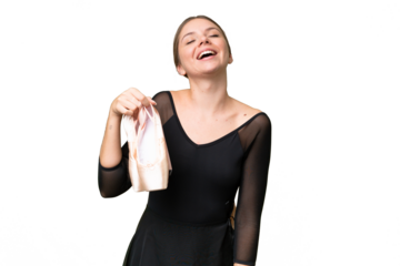 Young beautiful blonde woman practicing ballet over isolated background laughing