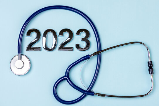 2023 New Year background with stethoscope on blue. Health care, health medical insurance and life insurance in year 2023 concept