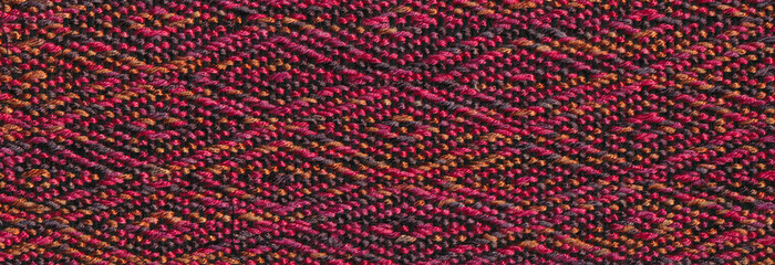 Closeup of colourful handwoven fabric.