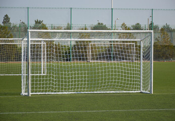 empty goal for mini football on the green lawn of the city stadium. preparation for a tournament or mini football championship. healthy lifestyle and active sports