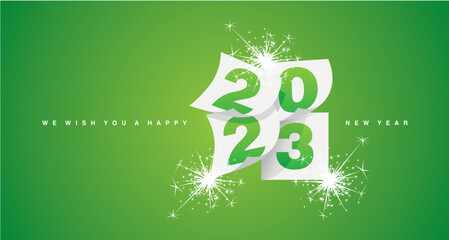 We wish you a Happy New Year 2023 greeting card design template with light sparkle firework on lucky green background. New Year 2023 start concept - obrazy, fototapety, plakaty