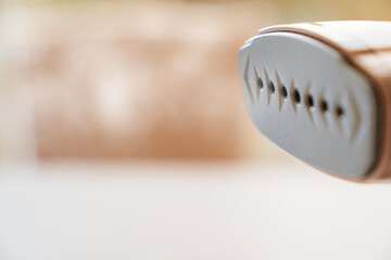 close up. Working portable hand steamer for clothes. steam for ironing clothes.