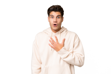 Young caucasian handsome man over isolated background surprised and shocked while looking right