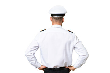 Airplane pilot man over isolated background in back position © luismolinero