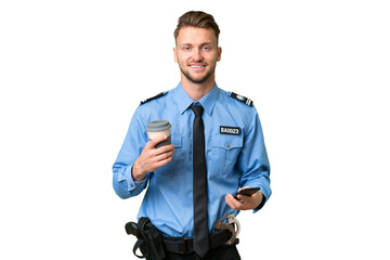 Young police man over isolated background holding coffee to take away and a mobile