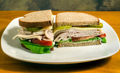 turkey sandwich top with prolone cheese and pickles