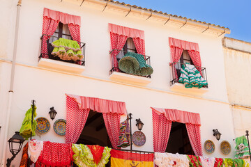 Colorful Spanish flamenco dresses hanging and drying on the balcony, Marbella; Spain.