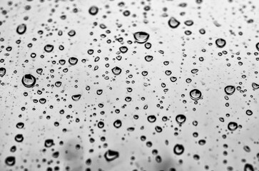 Macro raindrops on window glass