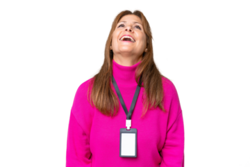 Middle-aged caucasian woman with ID card over isolated background laughing