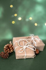 Christmas and zero waste, eco friendly packaging. wrapped gifts in craft paper with pine cones and...