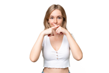 Young English woman over isolated background showing a sign of silence gesture