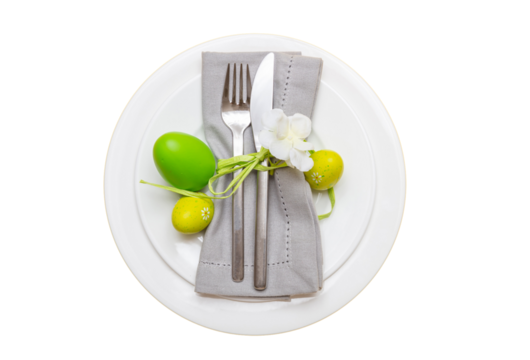Easter table setting isolated transparent background, PNG. Easter eggs decoration, white plate, napkin and cutlery, top view