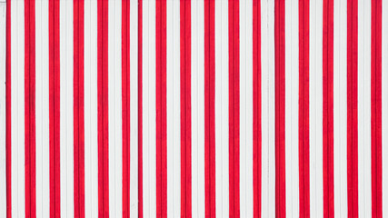 Close-up view on the abstract painted striped wall. Red and white stripes on the wall.