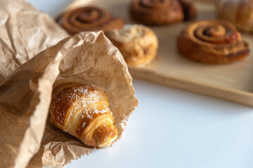 croissant is in a craft bag on the table
