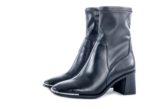 A Pair of Women's Black Leather High Heel Ankle Boot With Metal Square Toe Isolated on White