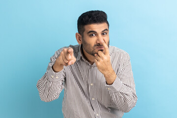 You are liar. Portrait of angry bearded man touching his nose with finger and showing lie gesture,...