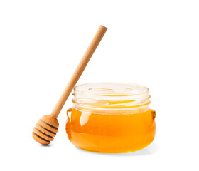 Fresh honey in a jar with a wooden dipper on a white isolated background.