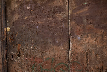 The old, ancient wooden door. Texture. Background. close up.	
