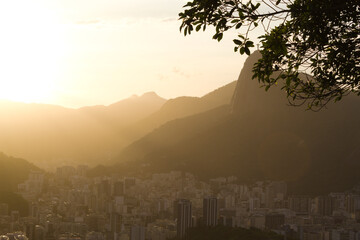 Sunset with Christ the Redeemer in Rio de Janeiro and its mountains