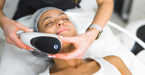 Professional spa facials concept. Erbium-yag fractional laser creating micro thermal zones in the...