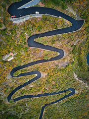 Curvy road in the middle of a lush landscape