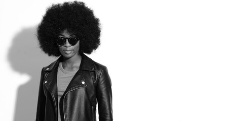 Black and white pictures of fashion model with afro hairstyle.