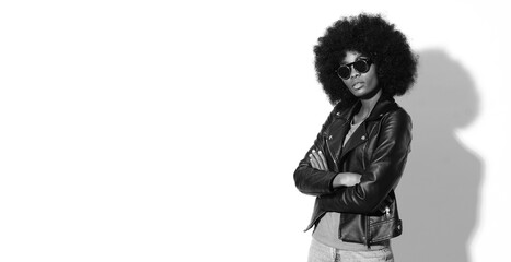 Black and white pictures of fashion model with afro hairstyle.