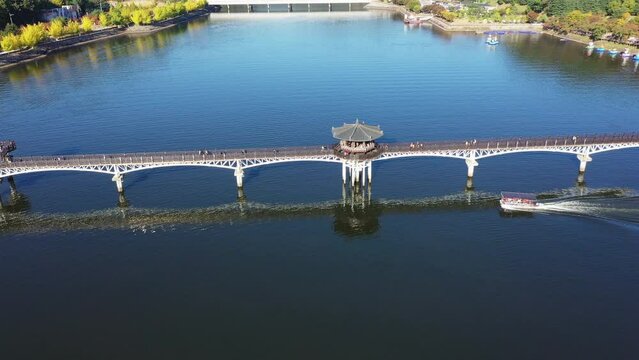Aerial view of Woryeonggyo Bridge in Autumn And the boat sailed into the river