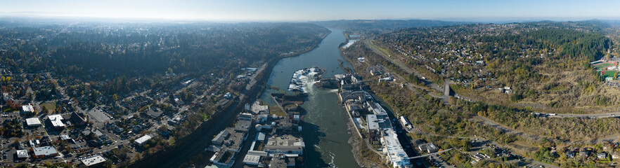 The Willamette Falls is a natural waterfall between West Linn and Oregon City, not far south of Portland, Oregon. By volume, this is the largest waterfall in the Northwestern United States.