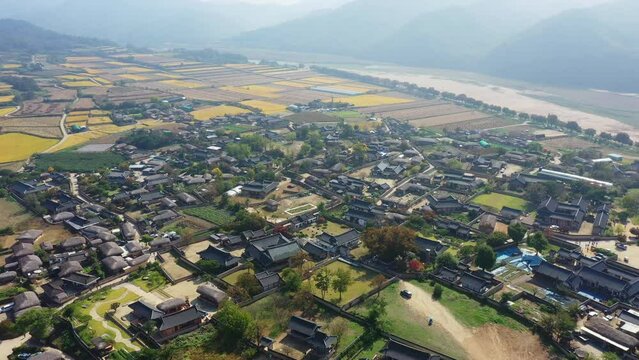 Aerial video of Andong Hahoe Folk Village in Autumn South Korea, A village surrounded by a river.