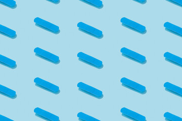 Pattern with medical patch on a blue background with deep shadows. Healthcare pharmacy and medicine concept