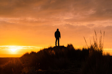 Lonely man watching the sunset