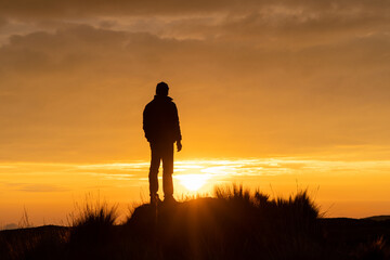 Lonely man watching the sunset