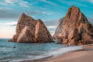 Fototapeta na wymiar incredible waves on the sea coast between the rocks in Portugal. beach, sunset, waves