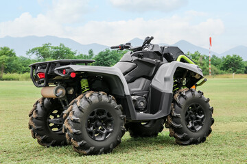 Modern quad bike on green grass outdoors