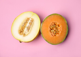 Tasty colorful ripe melons on pink background, flat lay