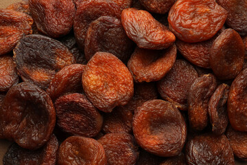 Tasty dried apricots as background, top view. Healthy snack