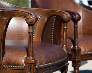 Old leather chairs in a flea market