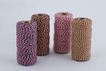 Spools of thick threads with interlaced patterns