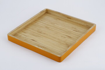 Simple wooden tray with orange exterior