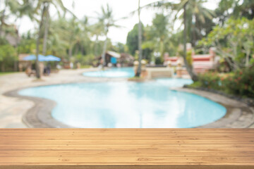 Fototapeta na wymiar Boards wood with unfocused background luxury swimming pool