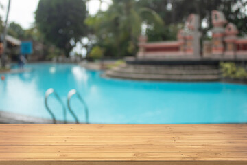 Boards wood with unfocused background luxury swimming pool