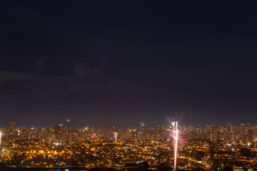 Fototapeta na wymiar Fireworks on the city in the night 