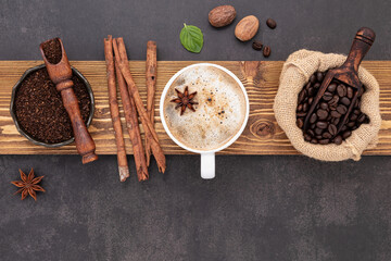  Roasted coffee beans with coffee powder and flavourful ingredients for make tasty coffee setup on dark stone background. - 548105136