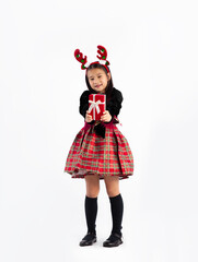 Asian kid student girl in black and red Christmas theme costume holding and giving red present box standing full length white background. Merry Christmas.