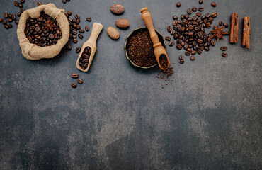  Roasted coffee beans with coffee powder and flavourful ingredients for make tasty coffee setup on dark stone background. - 548105757