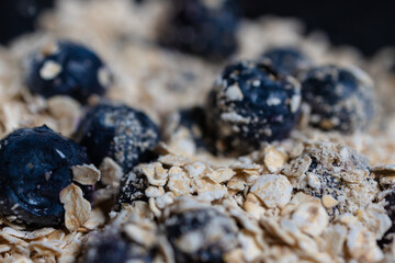 Close-up blurred background, oatmeal with blueberries.