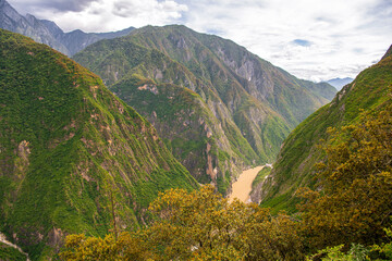 Scenery of Tiger leaping gorge. Tibetan part of Yunnan, China. Sunny day, sky with clouds