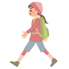 リュックを背負って歩く笑顔の若い女性