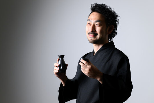Japanese man toasting sake (Japanese alcohol), 
